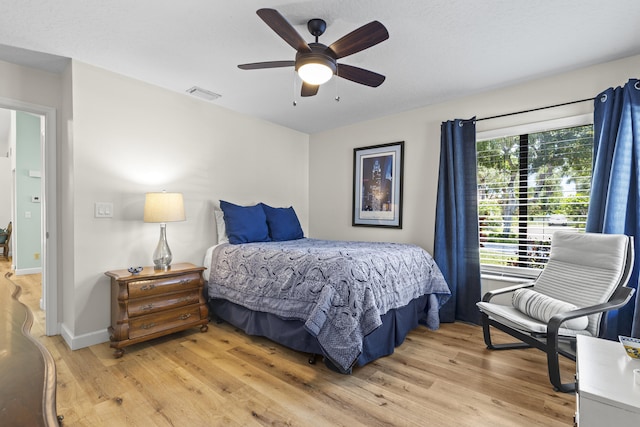 701 Sea Oats Dr Unit A-4, Juno Beach, FL 33408 - bedroom with light wood-type flooring and ceiling fan