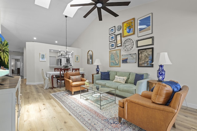 701 Sea Oats Dr Unit A-4, Juno Beach, FL 33408 - living area featuring a ceiling fan, light wood-type flooring, a skylight, recessed lighting, and high vaulted ceiling