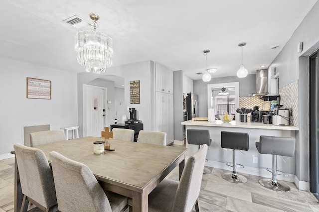 8611 NW 47th Ct, Lauderhill, FL 33319 - dining space with arched walkways, baseboards, and ceiling fan