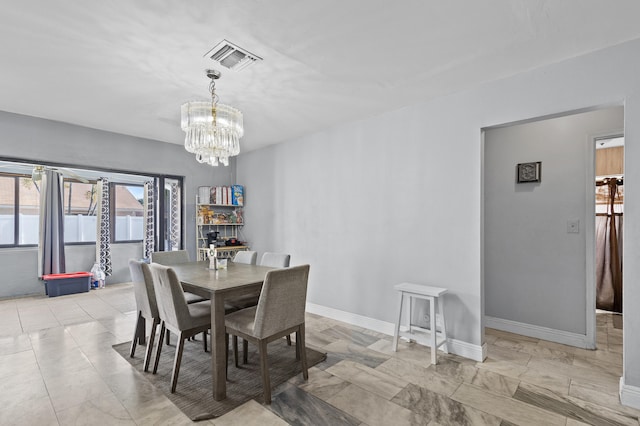 8611 NW 47th Ct, Lauderhill, FL 33319 - dining room with a chandelier and baseboards