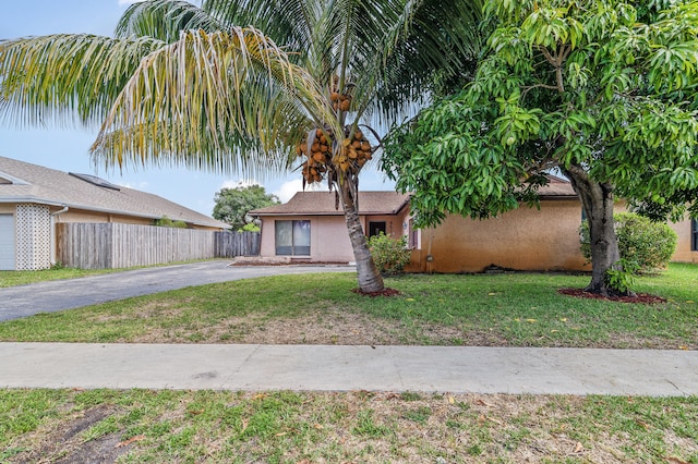 8611 NW 47th Ct, Lauderhill, FL 33319 - view of front of home featuring asphalt driveway and stucco siding