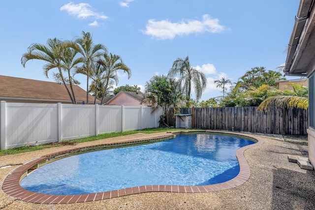 8611 NW 47th Ct, Lauderhill, FL 33319 - view of pool with a fenced backyard