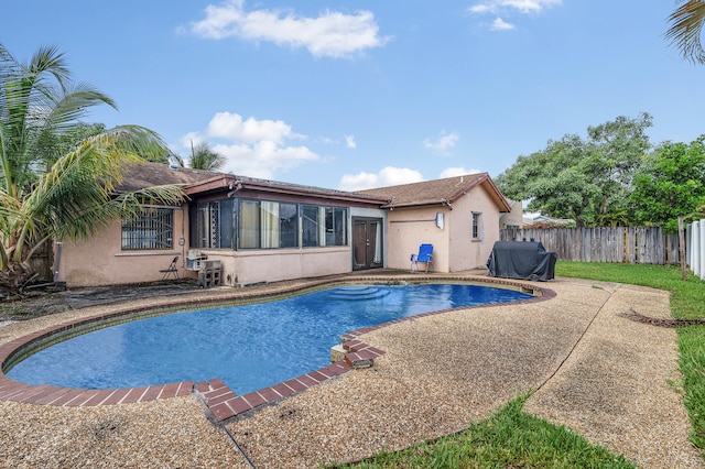 8611 NW 47th Ct, Lauderhill, FL 33319 - view of pool with a fenced backyard and a patio