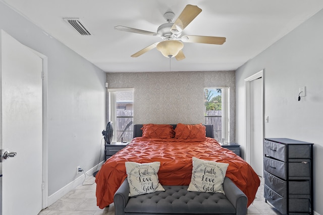 8611 NW 47th Ct, Lauderhill, FL 33319 - bedroom featuring light marble finish floors, a ceiling fan, and baseboards