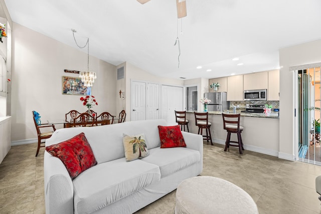 1603 Springdale Ct, Palm Beach Gardens, FL 33403 - living area with recessed lighting, baseboards, a chandelier, and lofted ceiling