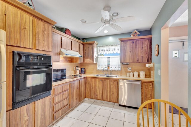 kitchen with black appliances, a sink, tasteful backsplash, light countertops, and recessed lighting