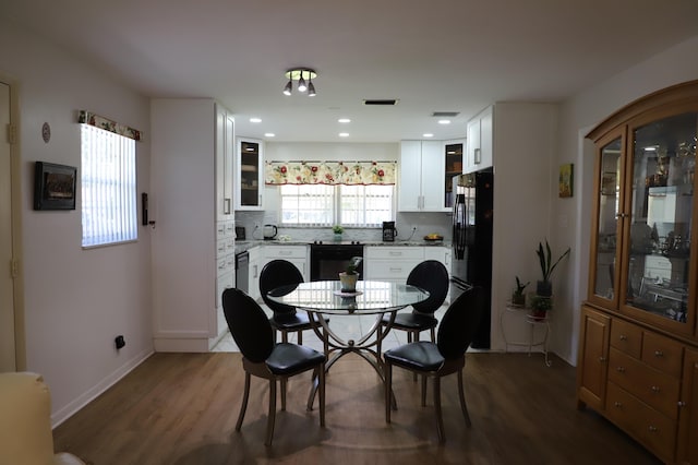 521 Sandpiper Cir, Delray Beach, FL 33445 - dining space featuring wood finished floors and baseboards