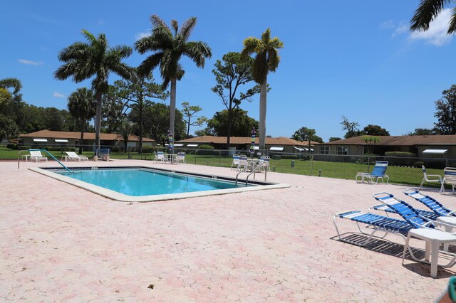 521 Sandpiper Cir, Delray Beach, FL 33445 - community pool featuring a patio