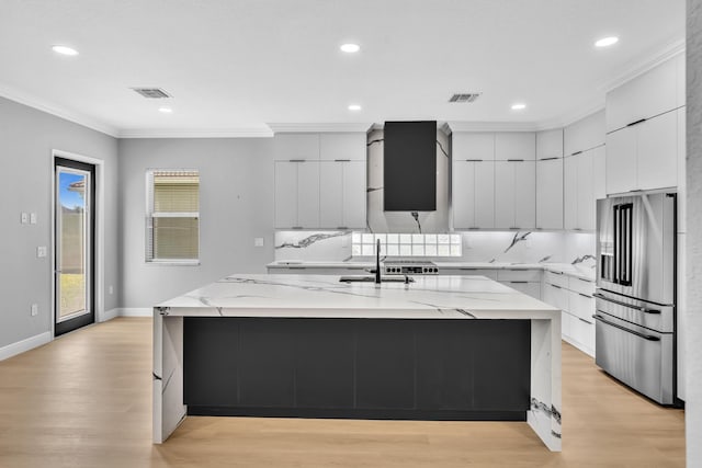 14838 Strand Ln, Delray Beach, FL 33446 - kitchen featuring high end refrigerator, modern cabinets, a sink, ornamental molding, and light wood-style floors