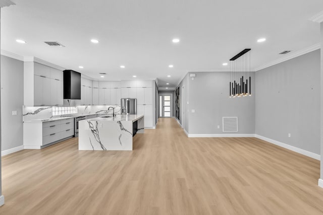 14838 Strand Ln, Delray Beach, FL 33446 - kitchen with modern cabinets, stainless steel fridge, ornamental molding, light wood-type flooring, and white cabinets