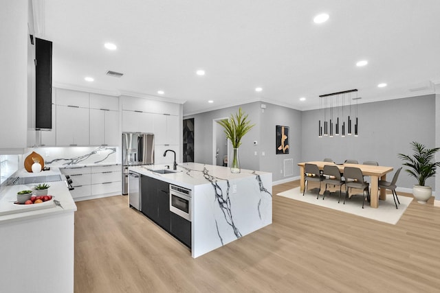 14838 Strand Ln, Delray Beach, FL 33446 - kitchen with stainless steel appliances, recessed lighting, crown molding, modern cabinets, and a sink
