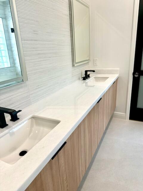 14838 Strand Ln, Delray Beach, FL 33446 - bathroom with tasteful backsplash and double vanity