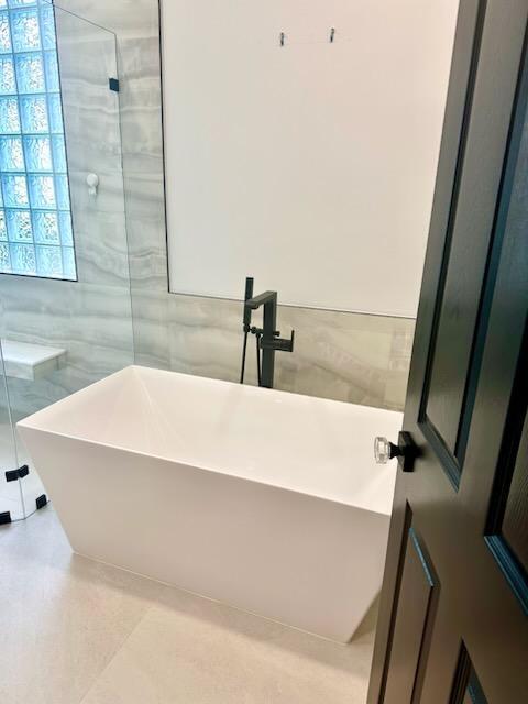 14838 Strand Ln, Delray Beach, FL 33446 - full bath featuring tile walls and a soaking tub
