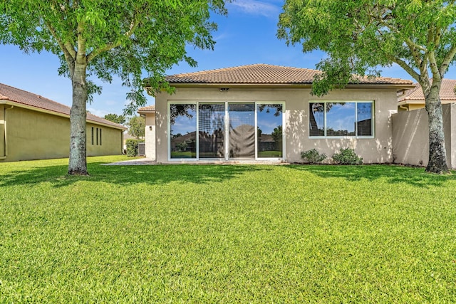 14838 Strand Ln, Delray Beach, FL 33446 - back of property with stucco siding, a tile roof, and a lawn