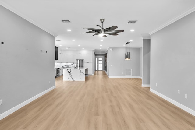 14838 Strand Ln, Delray Beach, FL 33446 - unfurnished living room with crown molding, ceiling fan, baseboards, recessed lighting, and light wood finished floors