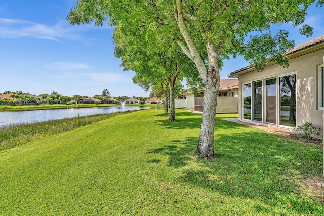 14838 Strand Ln, Delray Beach, FL 33446 - view of green lawn featuring a water view