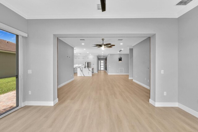 14838 Strand Ln, Delray Beach, FL 33446 - unfurnished living room featuring a ceiling fan, light wood-style floors, ornamental molding, and recessed lighting