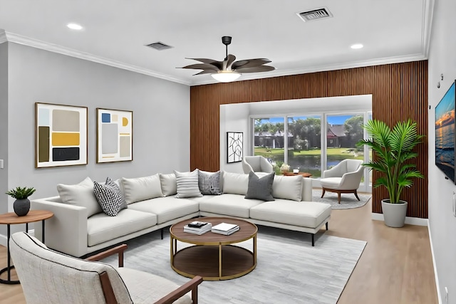 14838 Strand Ln, Delray Beach, FL 33446 - living area with crown molding, a ceiling fan, light wood-style floors, recessed lighting, and wooden walls