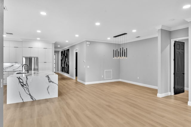14838 Strand Ln, Delray Beach, FL 33446 - kitchen with recessed lighting, baseboards, modern cabinets, stainless steel fridge, and white cabinets