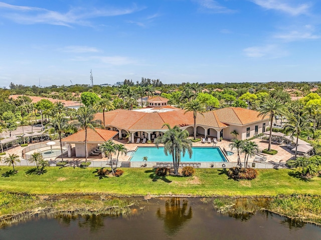 14838 Strand Ln, Delray Beach, FL 33446 - aerial view of property and surrounding area with a pool, a nearby body of water, and a tree filled landscape
