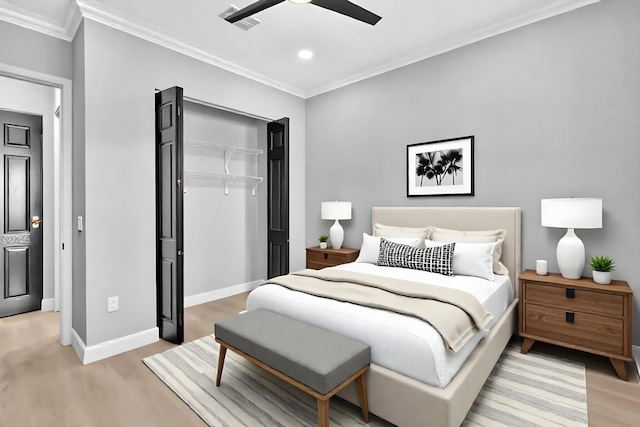 14838 Strand Ln, Delray Beach, FL 33446 - bedroom with crown molding, light wood-type flooring, baseboards, a closet, and ceiling fan