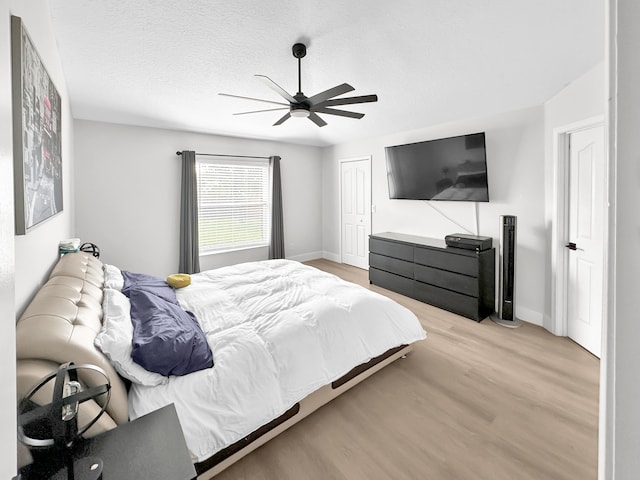 1726 SW Erie St, Port Saint Lucie, FL 34953 - bedroom featuring baseboards, light wood finished floors, a ceiling fan, and a closet
