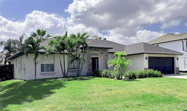 1726 SW Erie St, Port Saint Lucie, FL 34953 - view of front of home featuring a garage, driveway, stone siding, and stucco siding