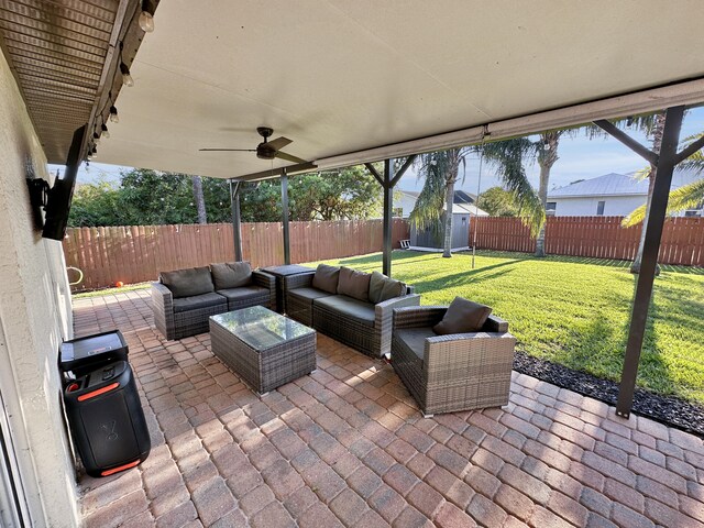 1726 SW Erie St, Port Saint Lucie, FL 34953 - view of patio / terrace featuring a storage unit, an outdoor structure, an outdoor living space, and ceiling fan