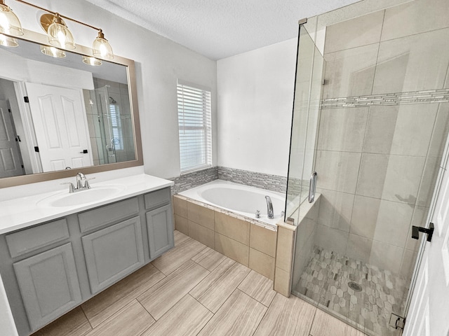 1726 SW Erie St, Port Saint Lucie, FL 34953 - full bath featuring a garden tub, a stall shower, vanity, and a textured ceiling