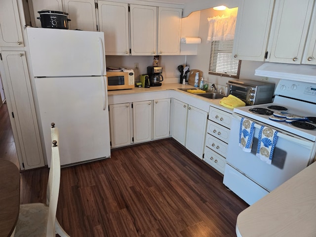 13 N Loafing St, Hypoluxo, FL 33462 - kitchen with white appliances, exhaust hood, white cabinetry, light countertops, and dark wood-type flooring