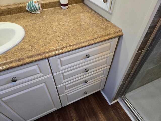 13 N Loafing St, Hypoluxo, FL 33462 - bathroom view of a shower stall, wood finished floors, and vanity