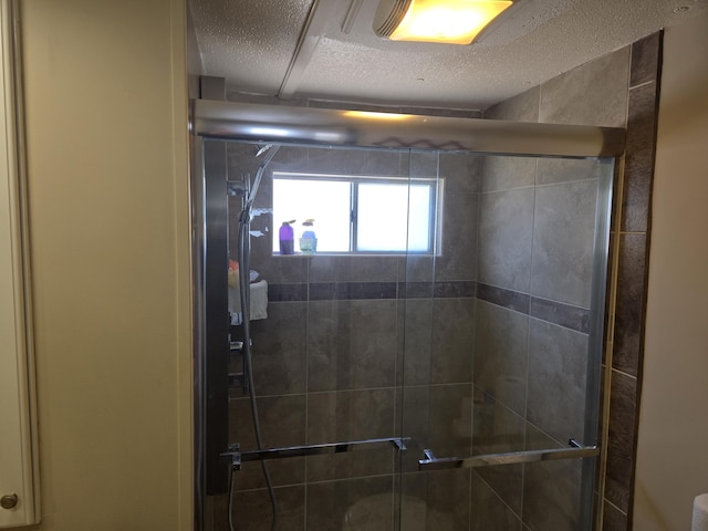 13 N Loafing St, Hypoluxo, FL 33462 - bathroom featuring a stall shower and a textured ceiling