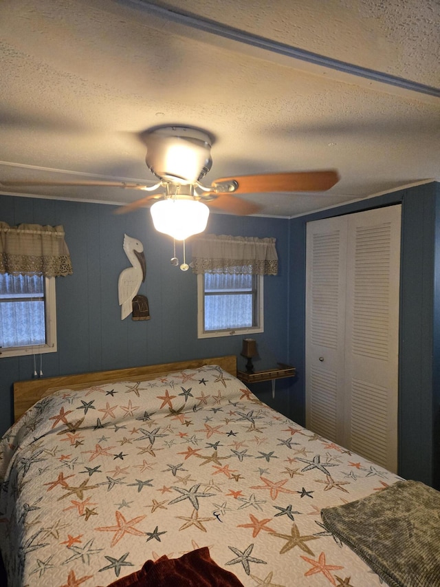 13 N Loafing St, Hypoluxo, FL 33462 - bedroom with a textured ceiling, ceiling fan, and a closet