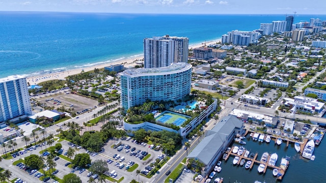 aerial view of property's location with a nearby body of water and nearby urban area