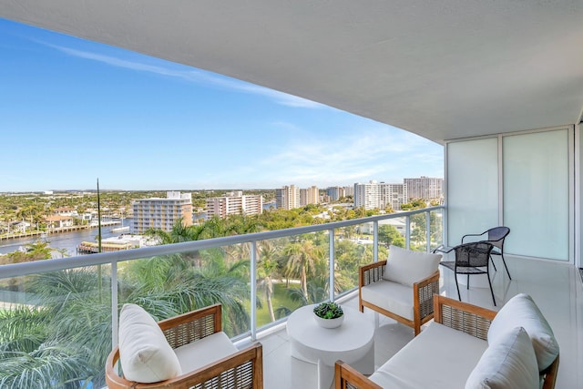 balcony with a view of city and a water view