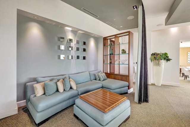 carpeted living room featuring baseboards