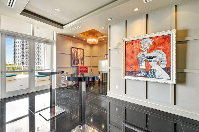 common area with a decorative wall and recessed lighting