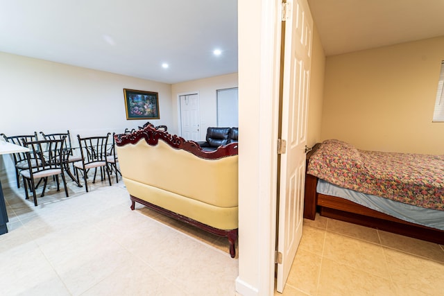 tiled living area with recessed lighting