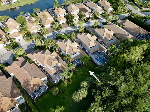 aerial overview of property's location with nearby suburban area and a nearby body of water