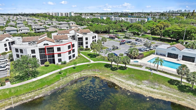 210 Lake Pointe Dr Unit 310, Oakland Park, FL 33309 - drone / aerial view of a pool and a nearby body of water