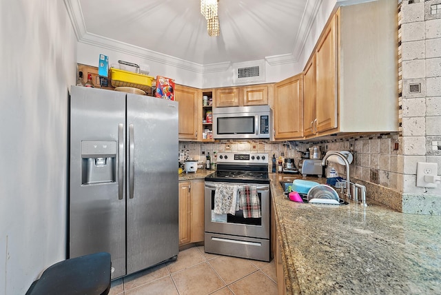 210 Lake Pointe Dr Unit 310, Oakland Park, FL 33309 - kitchen featuring appliances with stainless steel finishes, light tile patterned floors, decorative backsplash, a chandelier, and open shelves