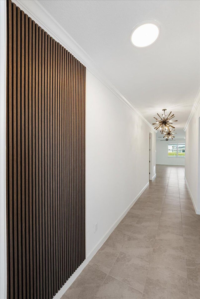 3527 Angler Dr, Fort Pierce, FL 34946 - hall featuring ornamental molding, a chandelier, and baseboards