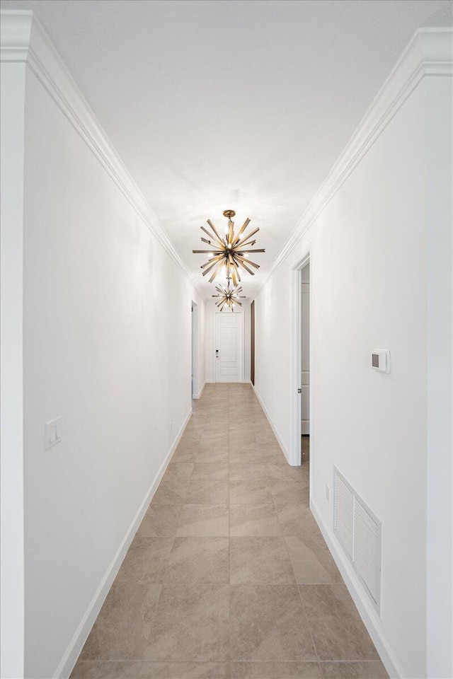 3527 Angler Dr, Fort Pierce, FL 34946 - hall with a chandelier, crown molding, and baseboards