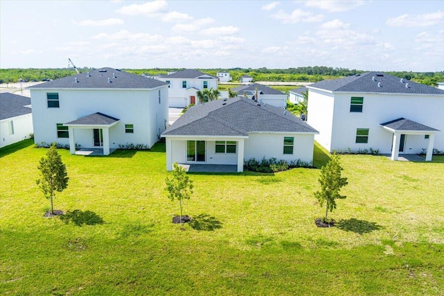 3527 Angler Dr, Fort Pierce, FL 34946 - rear view of property featuring a patio area and a yard