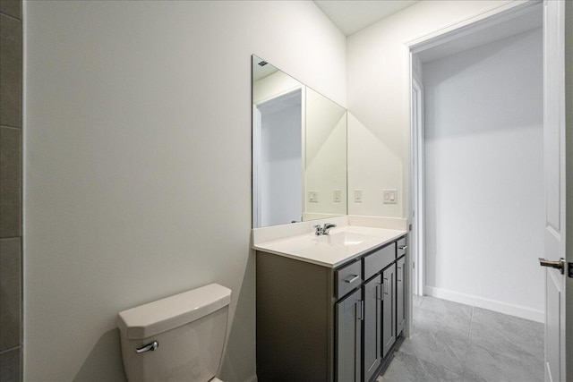 3527 Angler Dr, Fort Pierce, FL 34946 - bathroom with toilet, vanity, and baseboards