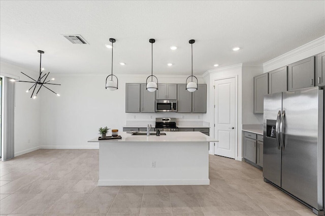 3527 Angler Dr, Fort Pierce, FL 34946 - kitchen with stainless steel appliances, gray cabinets, a sink, ornamental molding, and recessed lighting