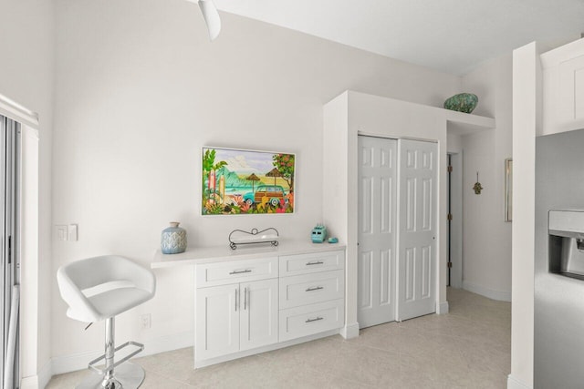 sitting room with light tile patterned flooring and baseboards