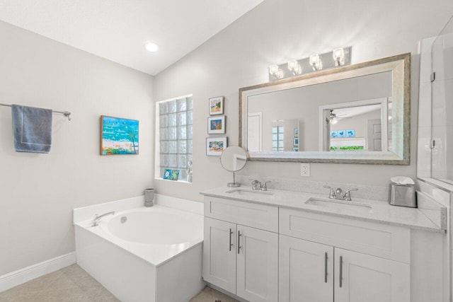 full bathroom featuring a bath, double vanity, baseboards, tile patterned floors, and a ceiling fan