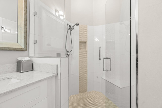 full bath featuring a shower stall and vanity