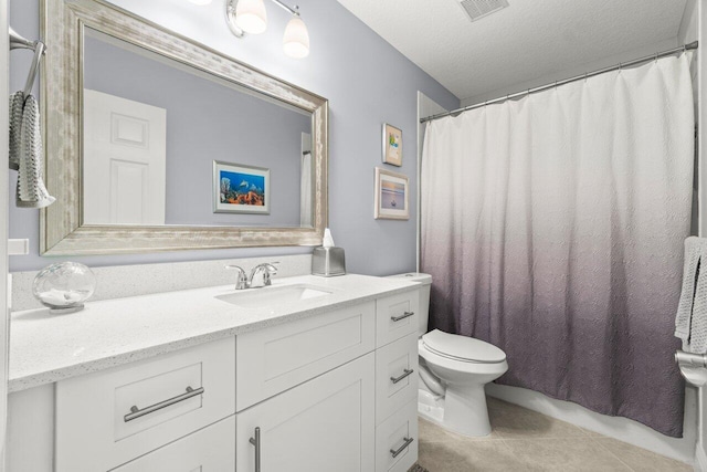 full bath with toilet, tile patterned flooring, vanity, and a textured ceiling